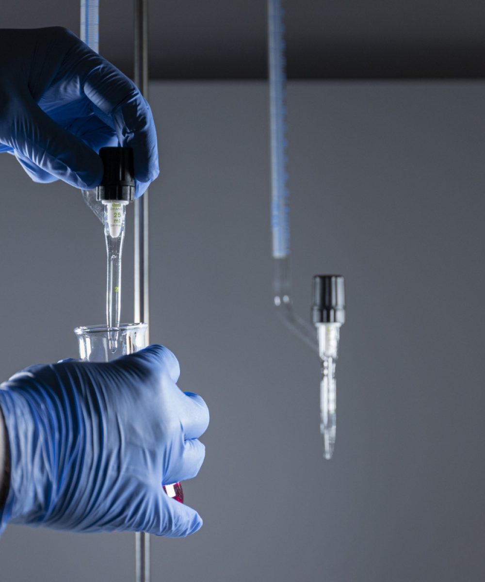scientist-medical-gloves-holding-test-tubes-analyzing-chemical-samples
